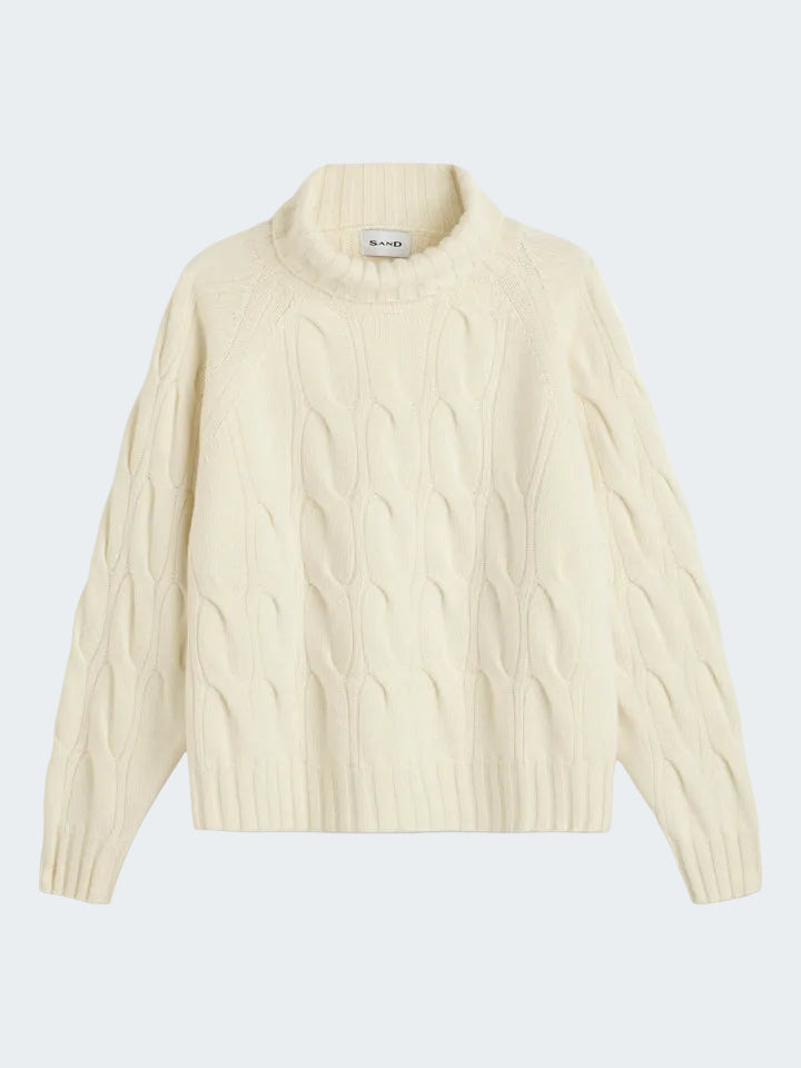 Cream-colored cable knit sweater