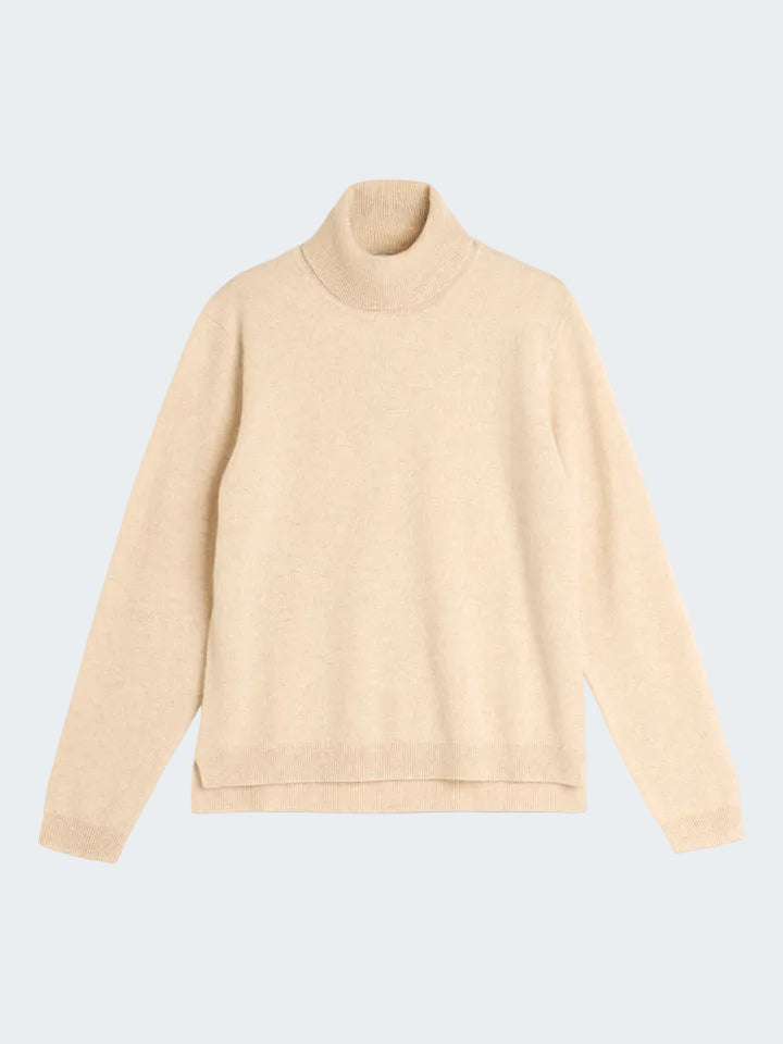 Beige turtleneck sweater on a white background